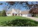Charming two-story home featuring a manicured lawn, attached two-car garage, and neutral color palette at 10295 Summerlin Way, Fishers, IN 46037