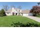 Charming two-story home featuring a manicured lawn, attached two-car garage, and neutral color palette at 10295 Summerlin Way, Fishers, IN 46037