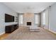 Gathering room with stone fireplace and hardwood floors at 10295 Summerlin Way, Fishers, IN 46037