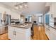 Eat-in kitchen with island, stainless steel appliances, and open concept to Gathering room at 10295 Summerlin Way, Fishers, IN 46037