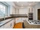 Spacious kitchen with granite countertops, stainless steel appliances, and white cabinets at 10295 Summerlin Way, Fishers, IN 46037