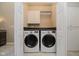 Laundry room with washer, dryer, and overhead storage at 10295 Summerlin Way, Fishers, IN 46037