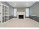 Home office with fireplace and neutral colored walls at 10295 Summerlin Way, Fishers, IN 46037
