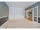 Built in shelving and french doors in the home office at 10295 Summerlin Way, Fishers, IN 46037