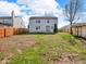Fenced backyard with grass and a shed at 11054 Dura Dr, Indianapolis, IN 46229
