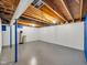 Unfinished basement with exposed wood ceiling, concrete floor, and essential plumbing at 11054 Dura Dr, Indianapolis, IN 46229