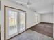 Bright breakfast nook with French doors, ceiling fan, and views of the backyard, adjacent to the kitchen at 11054 Dura Dr, Indianapolis, IN 46229