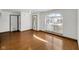 Hardwood floors and large window create a bright and inviting space, perfect for relaxation and entertainment at 11054 Dura Dr, Indianapolis, IN 46229