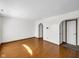Spacious living room features hardwood floors and arched doorways leading to additional rooms at 11054 Dura Dr, Indianapolis, IN 46229