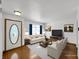 Virtually staged living room showcasing hardwood floors and neutral tones with modern furniture at 11054 Dura Dr, Indianapolis, IN 46229