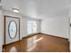Bright living room with hardwood floors, a large window, and a neutral color palette at 11054 Dura Dr, Indianapolis, IN 46229