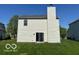 Back of house, showing sliding glass doors and chimney at 11663 Congressional Ln, Indianapolis, IN 46235