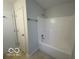 Bathroom with a shower-tub combo at 11663 Congressional Ln, Indianapolis, IN 46235