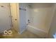 Clean bathroom with a tub and shower at 11663 Congressional Ln, Indianapolis, IN 46235