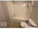 Bathroom featuring a shower/tub combo, toilet and light colored flooring at 11663 Congressional Ln, Indianapolis, IN 46235