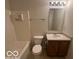 Bathroom with tub, toilet and wood-look flooring at 11663 Congressional Ln, Indianapolis, IN 46235