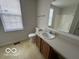 Bathroom with vanity, toilet, and bathtub at 11663 Congressional Ln, Indianapolis, IN 46235