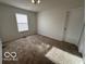 Spacious bedroom with neutral-toned carpeting and ample natural light at 11663 Congressional Ln, Indianapolis, IN 46235