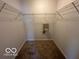 Walk-in closet with ample shelving and carpeted floor space at 11663 Congressional Ln, Indianapolis, IN 46235