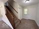 Entryway with stairs, closet and neutral decor at 11663 Congressional Ln, Indianapolis, IN 46235