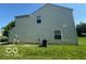 View of house showing vinyl siding, windows and lawn at 11663 Congressional Ln, Indianapolis, IN 46235