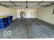 Spacious garage with concrete floor and white walls offering ample parking at 11663 Congressional Ln, Indianapolis, IN 46235