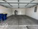 Attached garage with an overhead door and ample space for parking and storage at 11663 Congressional Ln, Indianapolis, IN 46235