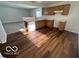 Kitchen with wood cabinets, a dishwasher, and vinyl flooring at 11663 Congressional Ln, Indianapolis, IN 46235