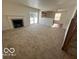 Spacious living room with a fireplace and access to the kitchen at 11663 Congressional Ln, Indianapolis, IN 46235