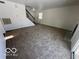 Large living room with carpeted floors and a view of the fireplace at 11663 Congressional Ln, Indianapolis, IN 46235