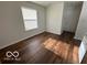 Living room featuring hardwood-style flooring and lots of natural light at 11663 Congressional Ln, Indianapolis, IN 46235