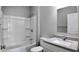 Clean bathroom with a shower/tub combo, vanity, and gray flooring at 1401 N Pershing Ave, Indianapolis, IN 46222