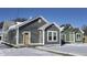 Three newly constructed homes with gray and green siding, snow-covered yards at 1401 N Pershing Ave, Indianapolis, IN 46222