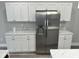 Stainless steel appliances and white cabinets in kitchen at 1407 N Pershing Ave, Indianapolis, IN 46222