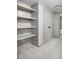 Unfinished basement with built-in shelving and closet at 17333 Ackerson Blvd, Westfield, IN 46074