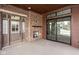 Covered patio with fireplace and French doors leading to backyard at 17333 Ackerson Blvd, Westfield, IN 46074