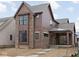 New two-story home featuring brick and cedar siding and black-trimmed windows at 17333 Ackerson Blvd, Westfield, IN 46074