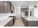 Modern kitchen with gray cabinets and white hex tile backsplash at 17333 Ackerson Blvd, Westfield, IN 46074