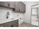Laundry room with cabinets, sink, and closet at 17333 Ackerson Blvd, Westfield, IN 46074