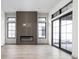 Modern living room featuring a linear fireplace and large windows at 17333 Ackerson Blvd, Westfield, IN 46074