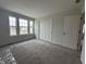 Bedroom with three windows and closet at 19983 Boulder Brook Ln, Westfield, IN 46074
