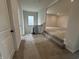 Upstairs hallway with carpeted stairs and a view of a spacious landing area at 19983 Boulder Brook Ln, Westfield, IN 46074
