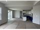Bright, open-concept kitchen and living area with white cabinets and island at 19983 Boulder Brook Ln, Westfield, IN 46074