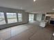 Open floorplan features a kitchen with a center island, large windows, and patio access at 19983 Boulder Brook Ln, Westfield, IN 46074