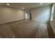 Bright living room with carpet, ample natural light, and an open layout at 19983 Boulder Brook Ln, Westfield, IN 46074