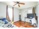 Bedroom with hardwood floors and a large window at 2003 S Bolton Ave, Indianapolis, IN 46203