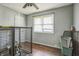 Bedroom with dog kennels and hardwood floors at 2003 S Bolton Ave, Indianapolis, IN 46203