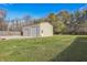 Tan metal garage with a grassy backyard at 2003 S Bolton Ave, Indianapolis, IN 46203
