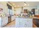 Kitchen with white cabinets, granite counters and island at 2003 S Bolton Ave, Indianapolis, IN 46203