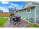 Patio with table and chairs in a fenced backyard at 2015 Columbia Ave, Indianapolis, IN 46202